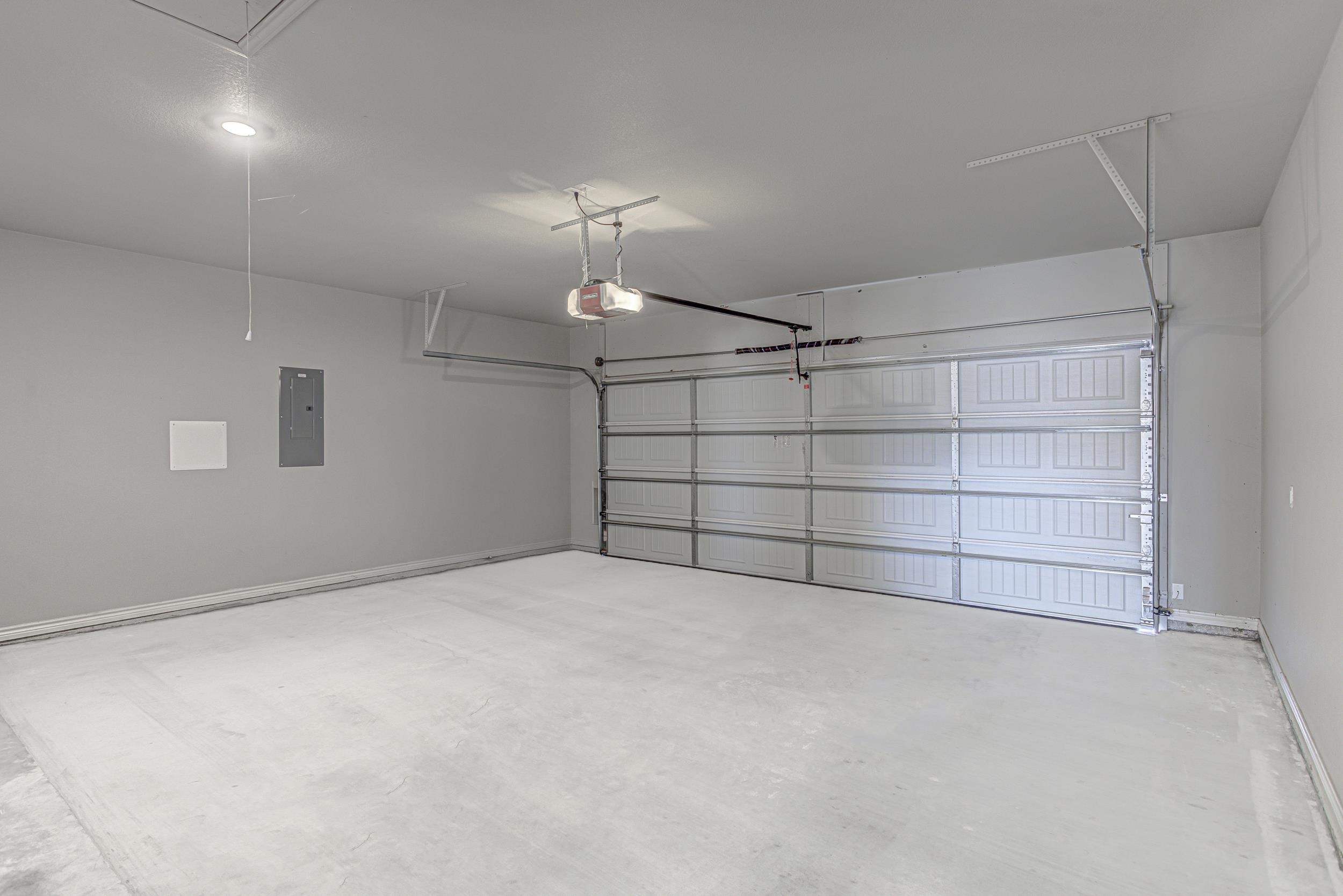 141 Rylee Road Burnet, TX 78611 - Photo 25 of 26 an empty room with a empty space and a ceiling fan