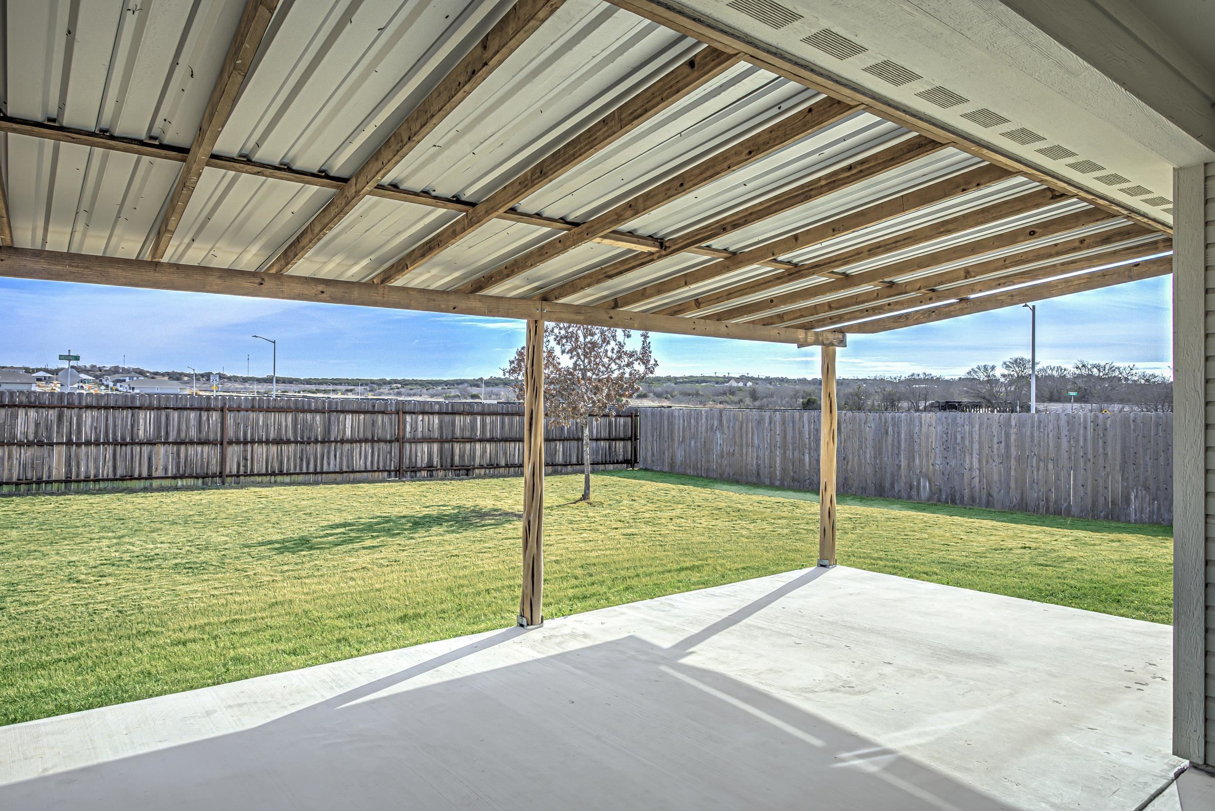 141 Rylee Road Burnet, TX 78611 - Photo 3 of 26 a view of a backyard with grass