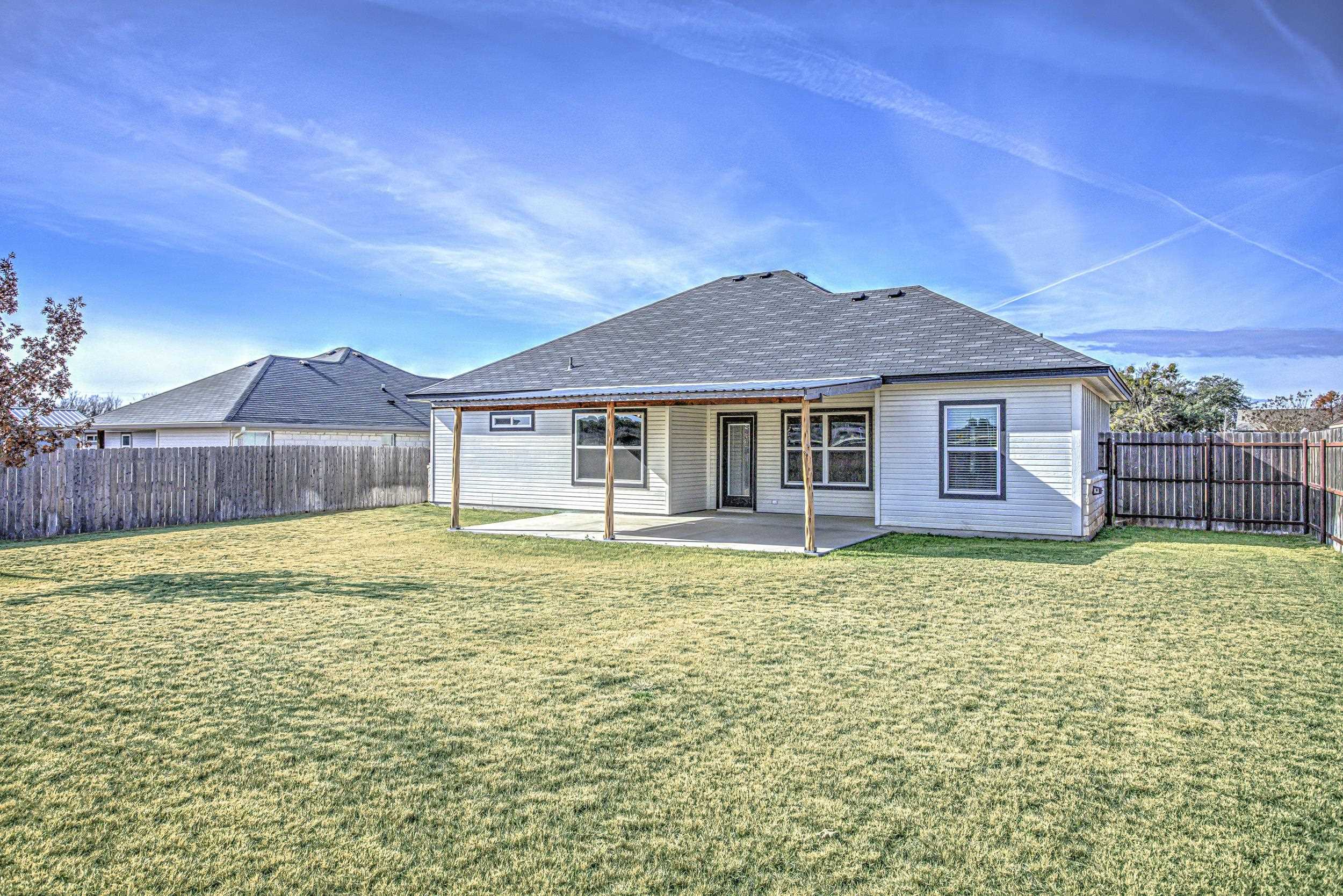 141 Rylee Road Burnet, TX 78611 - Photo 5 of 26 a backyard of a house