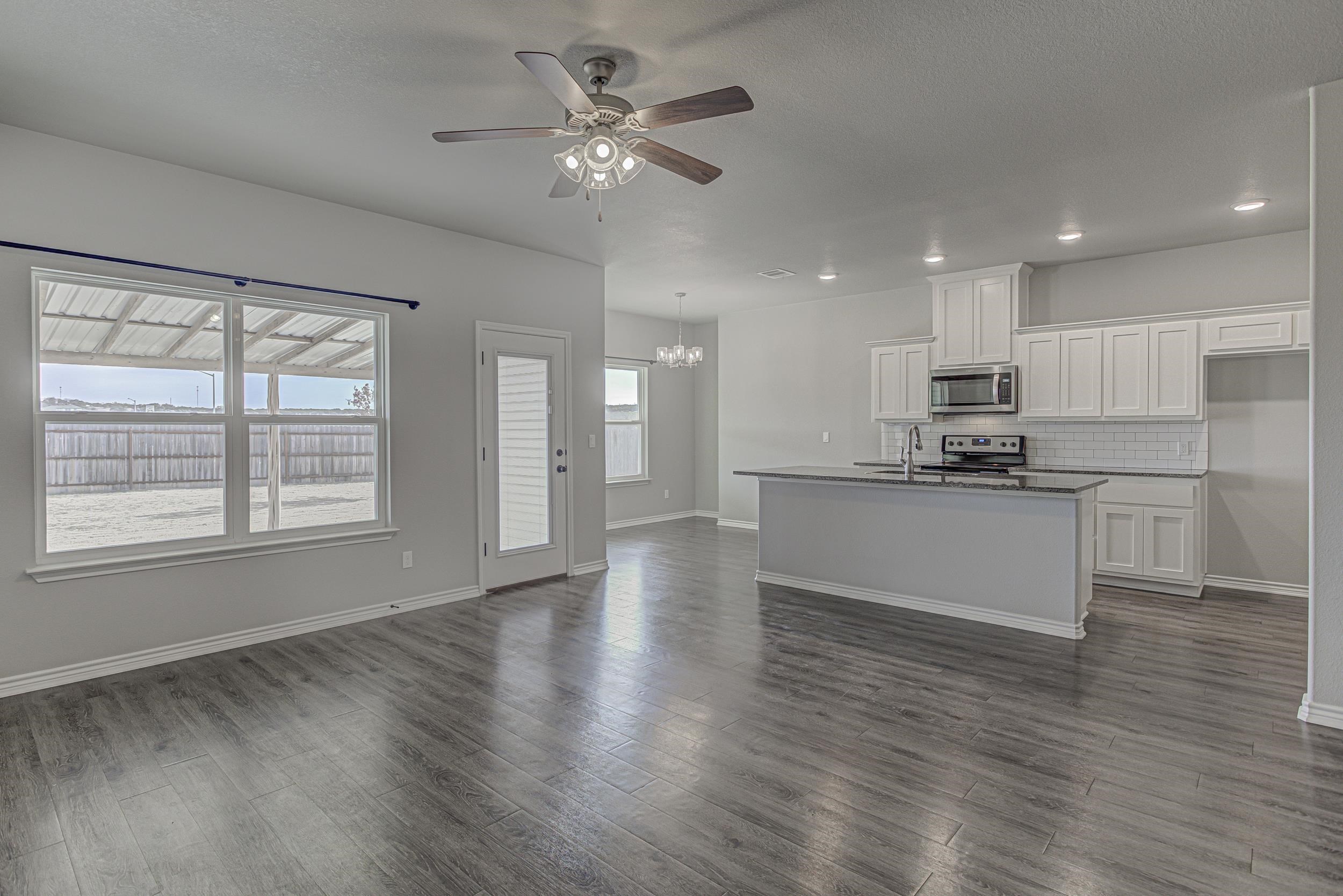 141 Rylee Road Burnet, TX 78611 - Photo 9 of 26 a view of kitchen with refrigerator and window