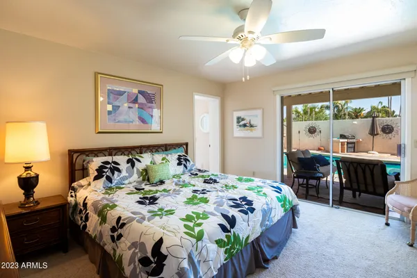 a bedroom with a bed and a table