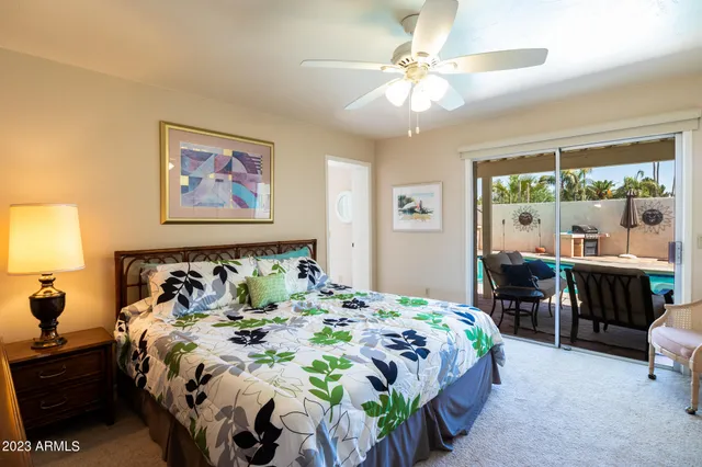 a bedroom with a bed and a table