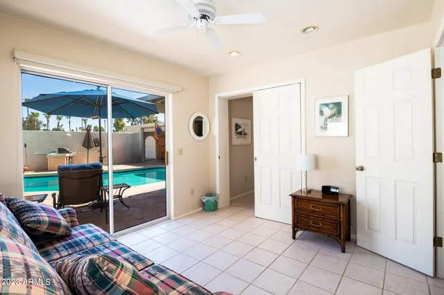 a bedroom with a bed and a view of balcony