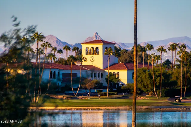 a swimming pool with outdoor seating and yard
