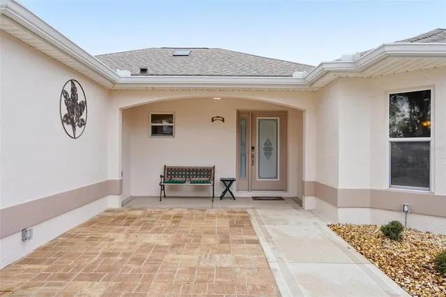 a view of a hallway with seating area