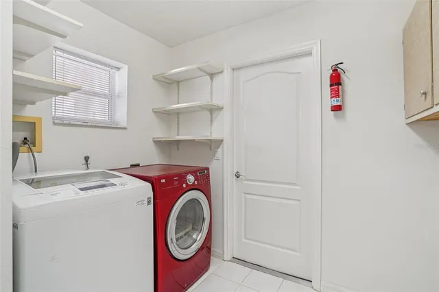 a front view of a house with a garden and plants