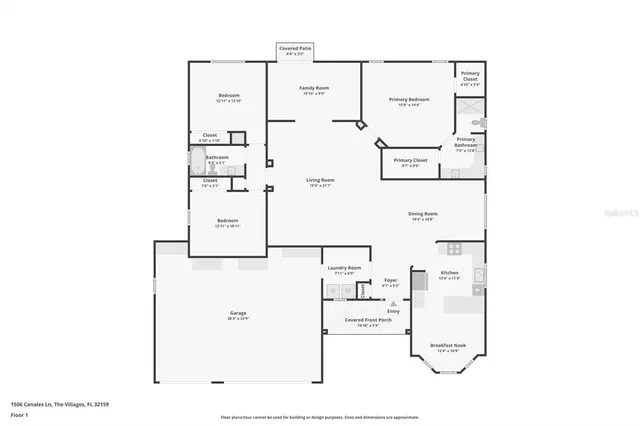 a view of kitchen with granite countertop cabinets and refrigerator