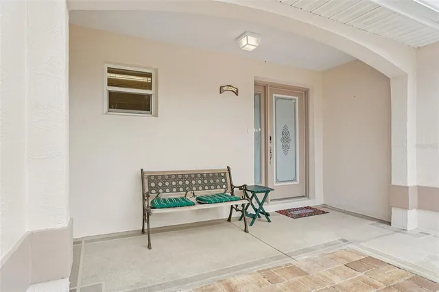 a backyard of a house with yard and outdoor seating