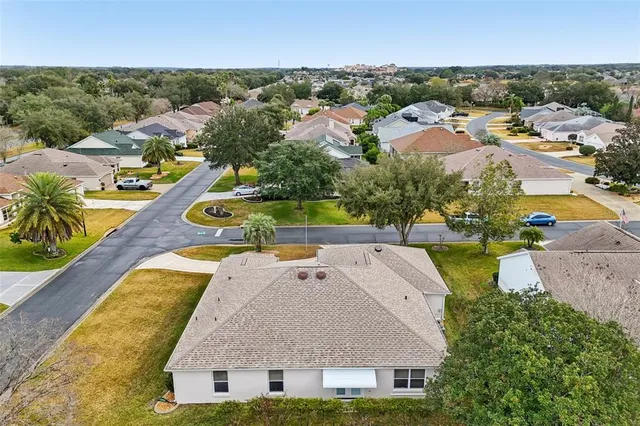 an aerial view of residential building and parking space