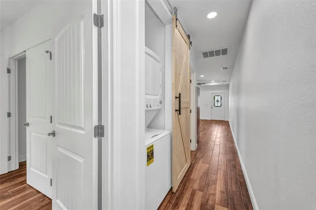 a bathroom with a granite countertop toilet sink and mirror