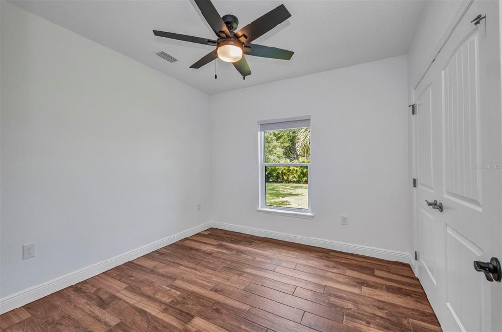 409 Carmalita Street, Unit 111 & 112 Punta Gorda, FL 33950 - Photo 18 of 75 an empty room with a window and a fan