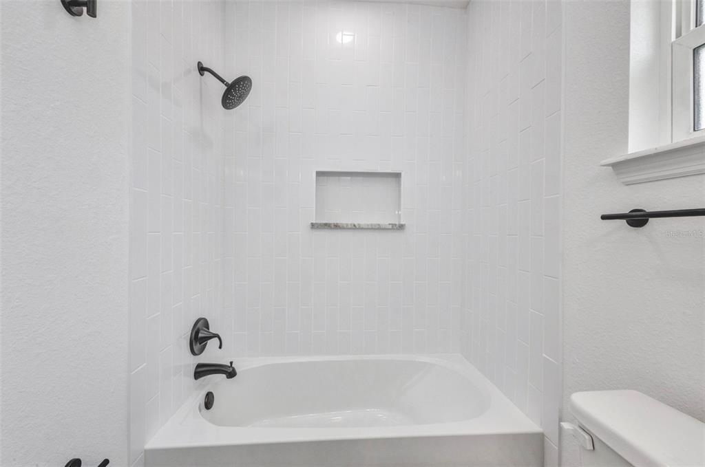 409 Carmalita Street, Unit 111 & 112 Punta Gorda, FL 33950 - Photo 29 of 75 a view of a bathtub in a bathroom