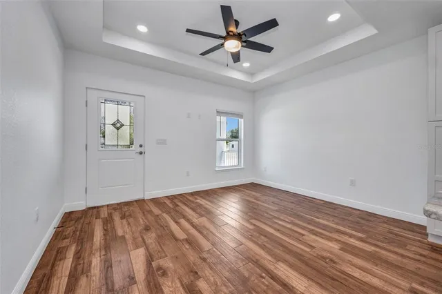 a bathroom with a granite countertop toilet sink and mirror