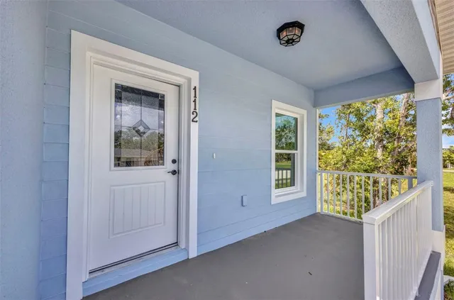 a kitchen with kitchen island granite countertop a sink stove and microwave