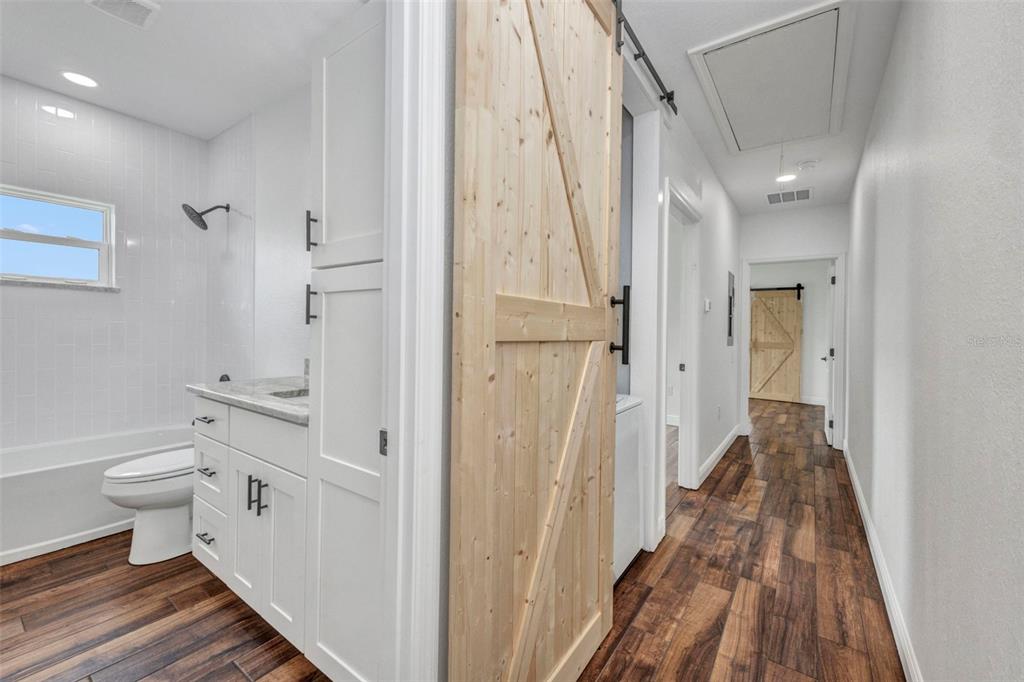 409 Carmalita Street, Unit 111 & 112 Punta Gorda, FL 33950 - Photo 43 of 75 a bathroom with a sink a toilet and shower