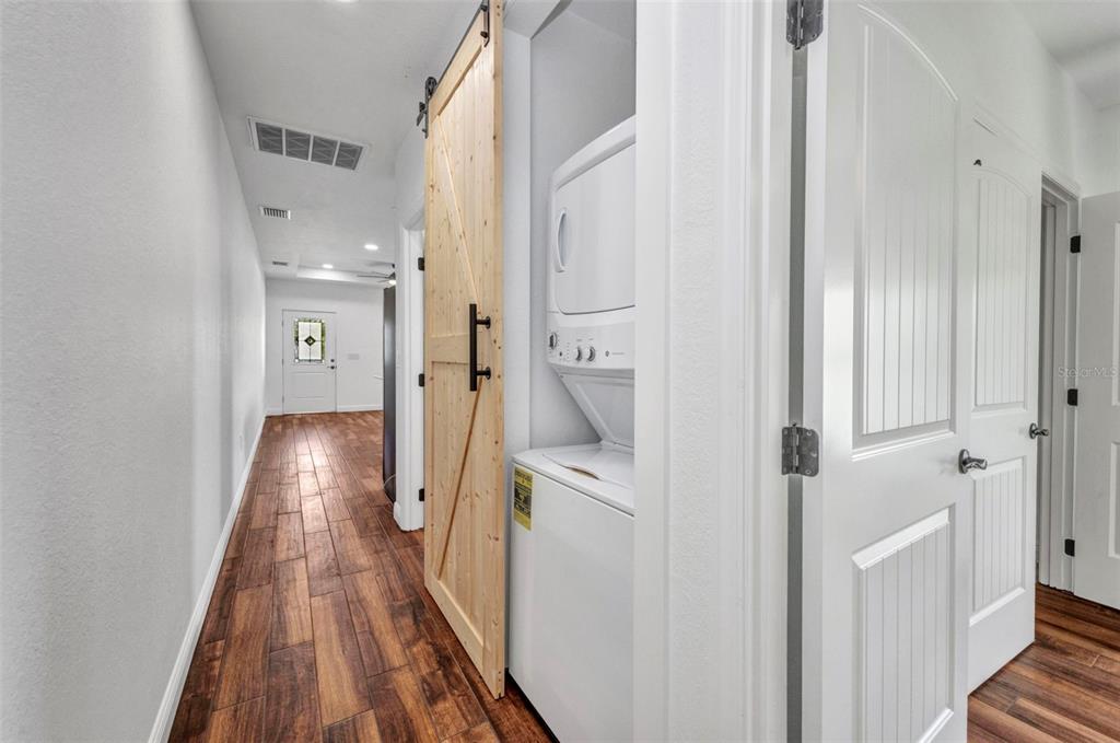 409 Carmalita Street, Unit 111 & 112 Punta Gorda, FL 33950 - Photo 44 of 75 a view of a hallway with wooden floor and staircase