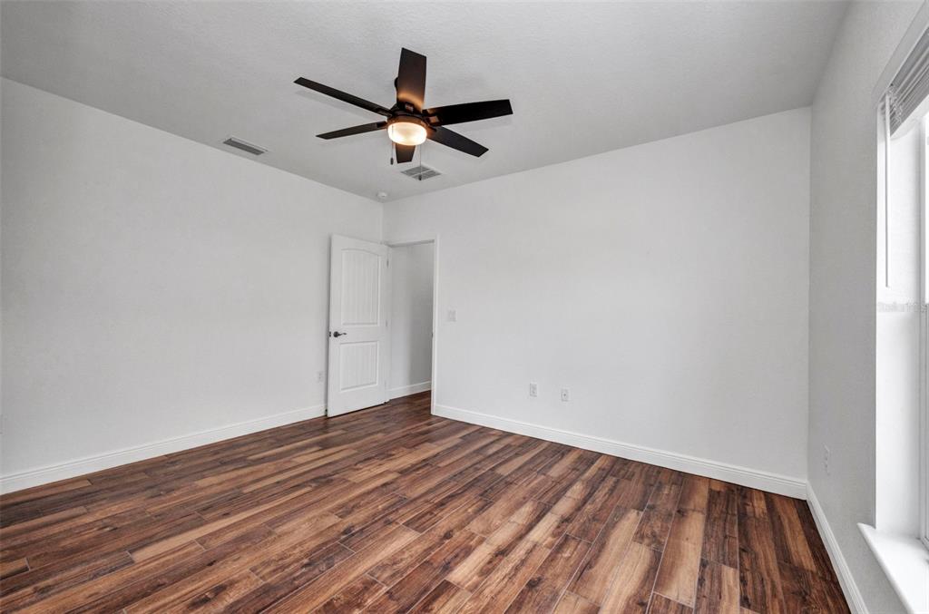 409 Carmalita Street, Unit 111 & 112 Punta Gorda, FL 33950 - Photo 50 of 75 a view of empty room with wooden floor
