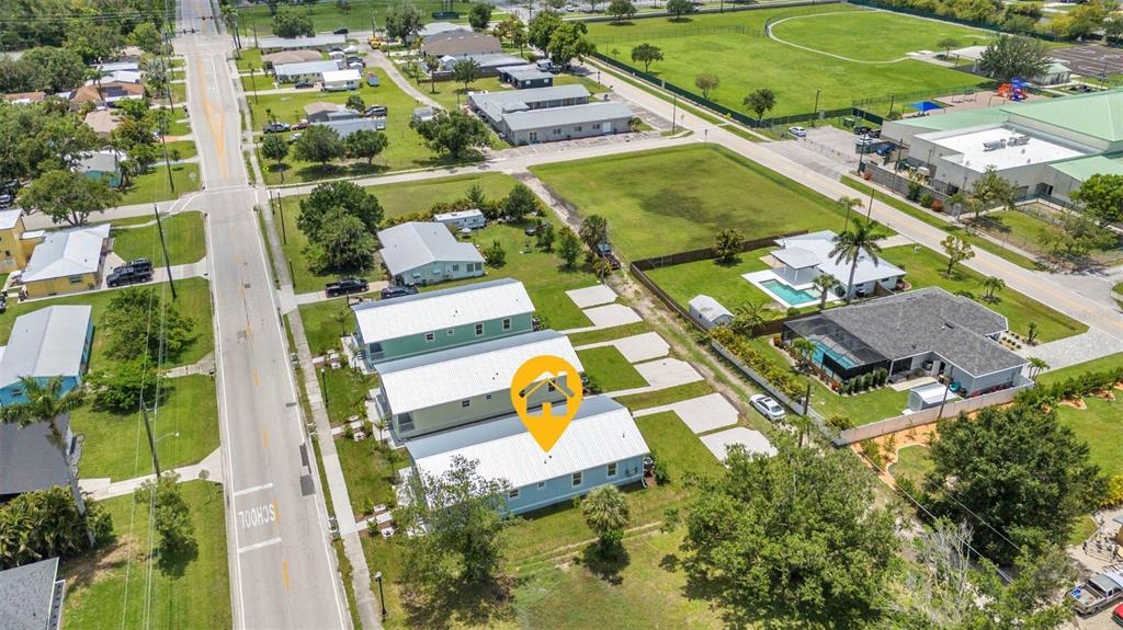 409 Carmalita Street, Unit 111 & 112 Punta Gorda, FL 33950 - Photo 59 of 75 an aerial view of residential houses with outdoor space