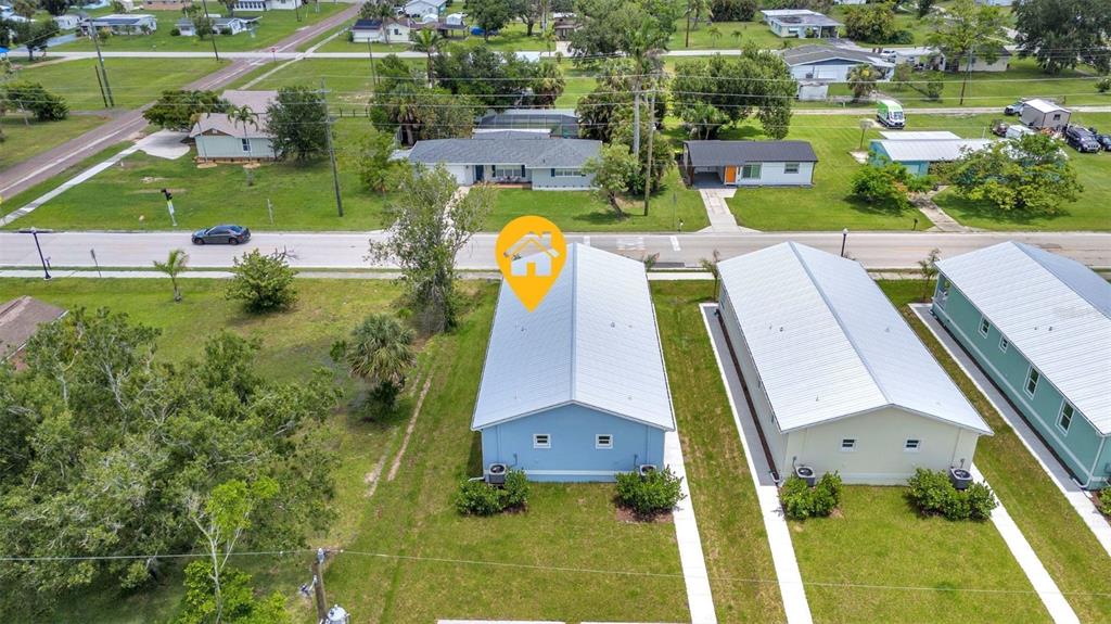 409 Carmalita Street, Unit 111 & 112 Punta Gorda, FL 33950 - Photo 60 of 75 an aerial view of residential houses with outdoor space and swimming pool