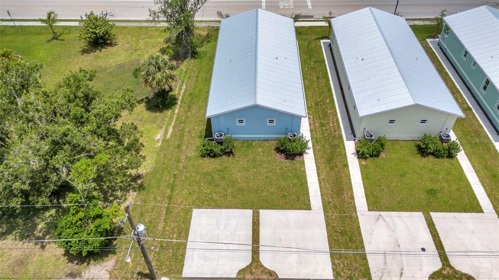 409 Carmalita Street, Unit 111 & 112 Punta Gorda, FL 33950 - Photo 63 of 75 an aerial view of a residential houses with yard