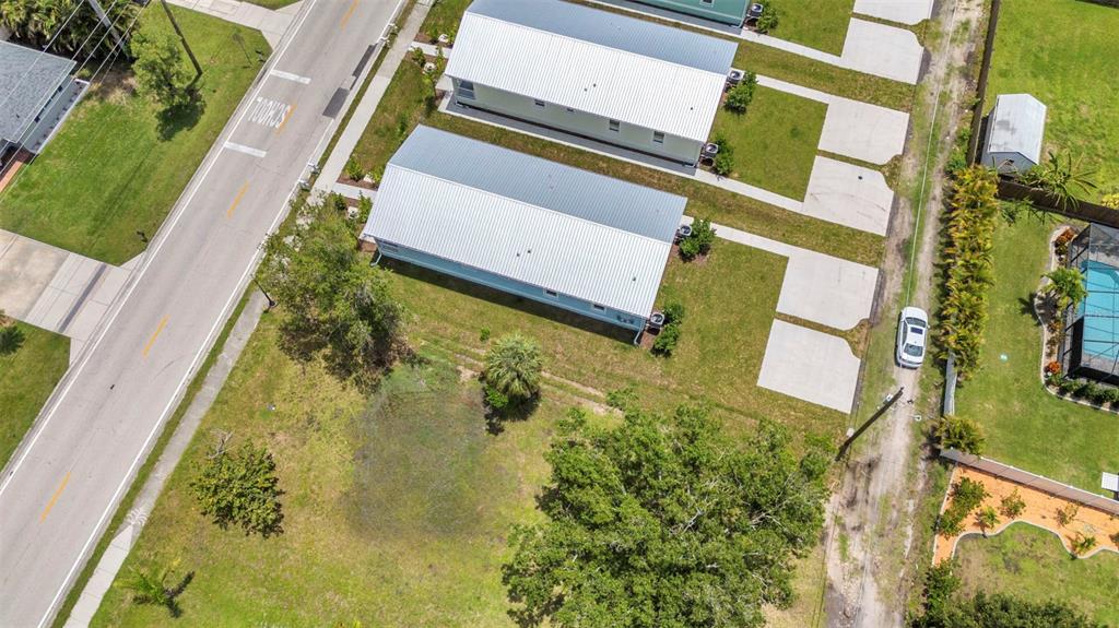 409 Carmalita Street, Unit 111 & 112 Punta Gorda, FL 33950 - Photo 65 of 75 a aerial view of a house with a swimming pool
