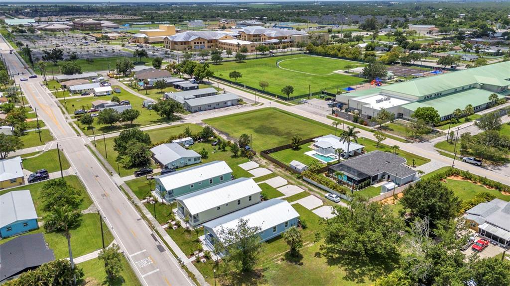 409 Carmalita Street, Unit 111 & 112 Punta Gorda, FL 33950 - Photo 68 of 75 an aerial view of a residential houses with outdoor space and street view