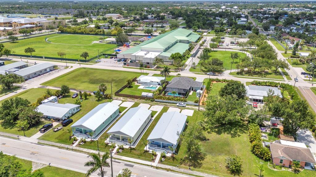 409 Carmalita Street, Unit 111 & 112 Punta Gorda, FL 33950 - Photo 70 of 75 an aerial view of a residential houses with outdoor space and a lake view
