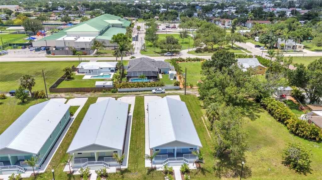 409 Carmalita Street, Unit 111 & 112 Punta Gorda, FL 33950 - Photo 72 of 75 an aerial view of residential houses with outdoor space and swimming pool