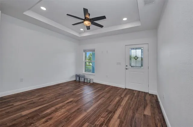 a white bath tub sitting next to a toilet