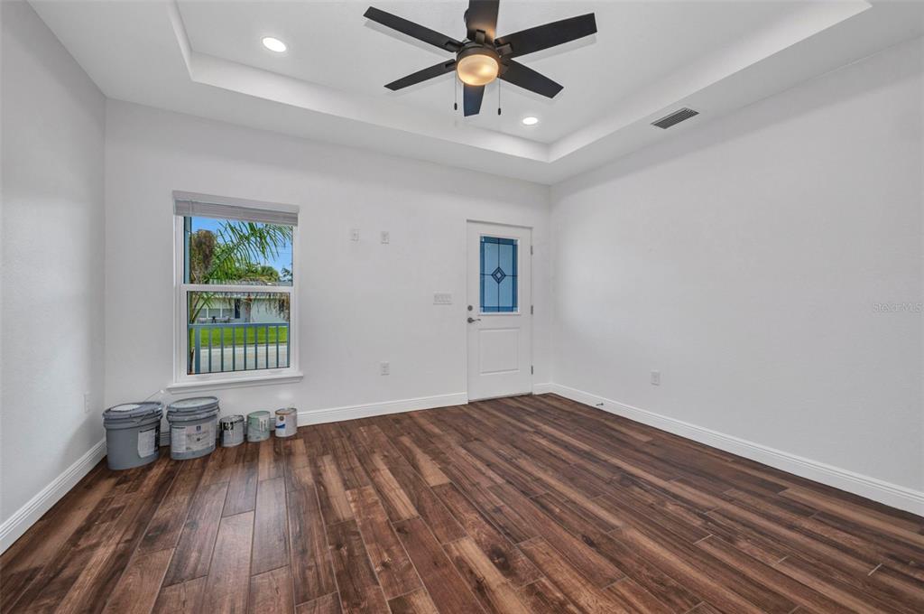 409 Carmalita Street, Unit 111 & 112 Punta Gorda, FL 33950 - Photo 10 of 75 wooden floor in an empty room with a window