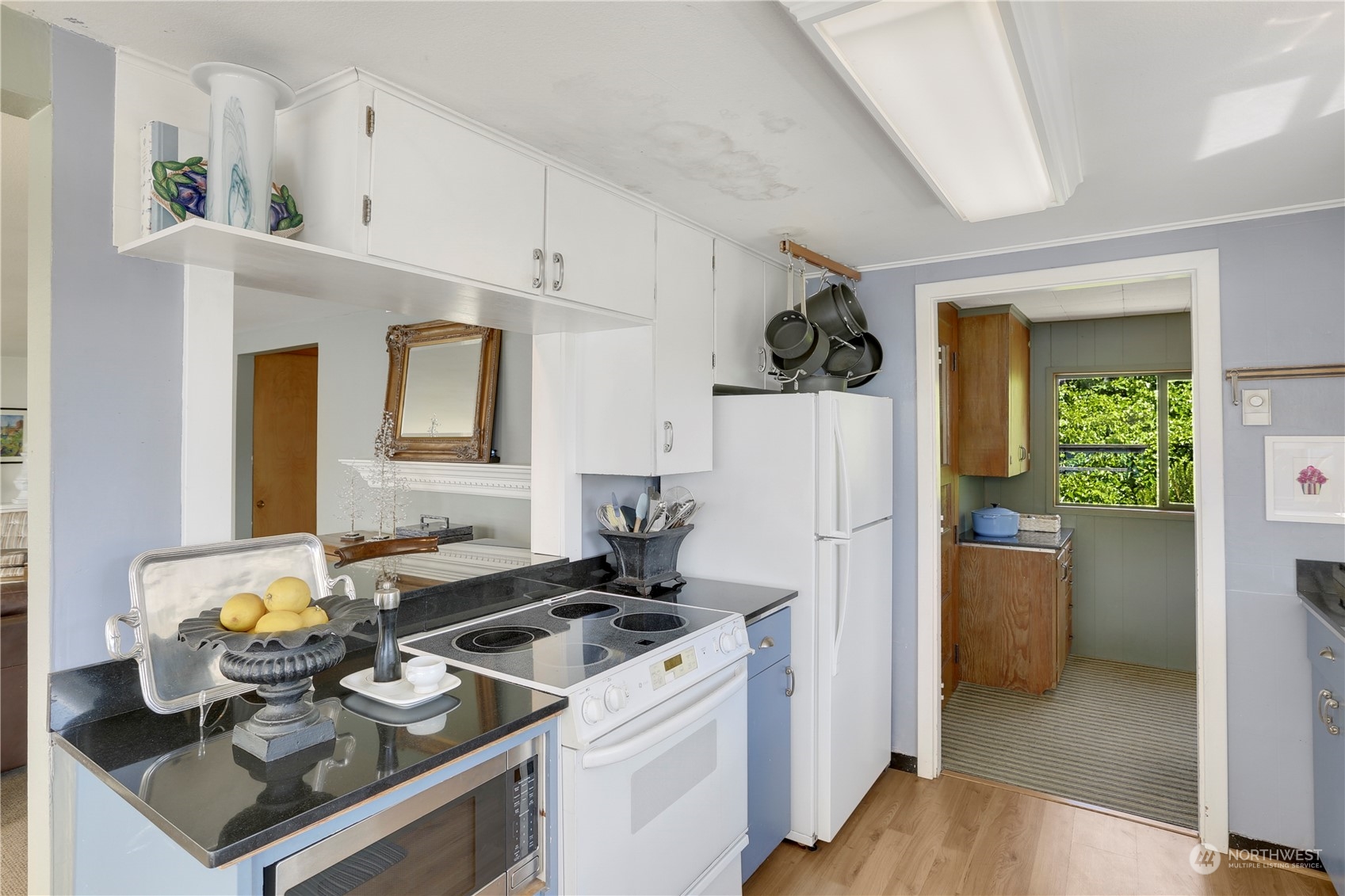 7005 Ripley Ln S East Renton, WA 98056 - Photo 12 of 35 a kitchen with a sink stove and refrigerator