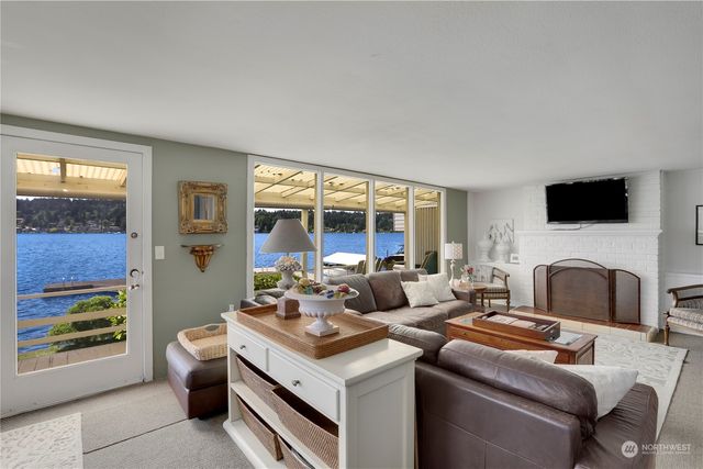 a kitchen with a sink cabinets and wooden floor