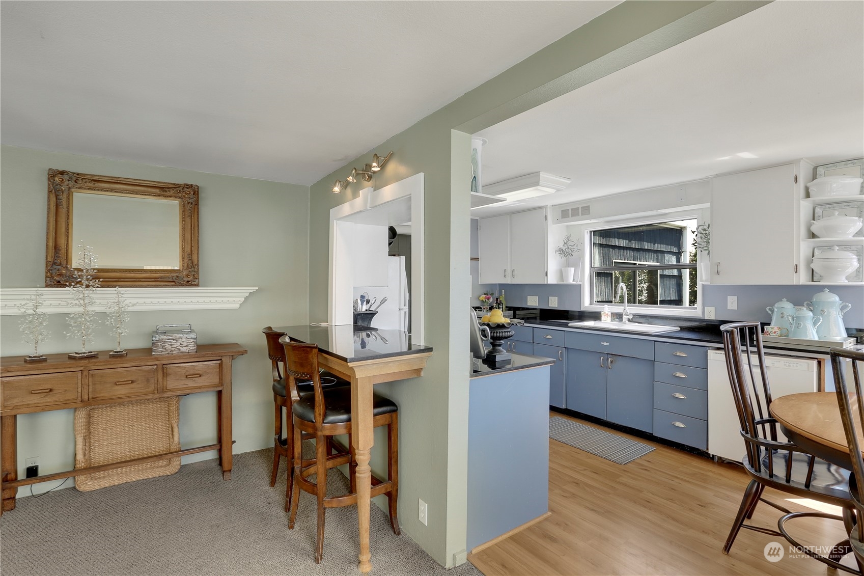 7005 Ripley Ln S East Renton, WA 98056 - Photo 17 of 35 a kitchen with a sink cabinets and wooden floor