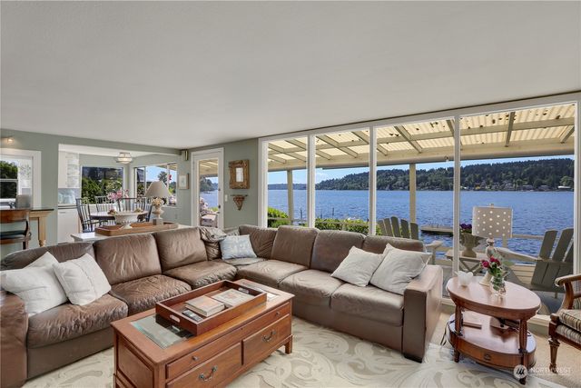 a bedroom with bed and wall painting with wooden floor