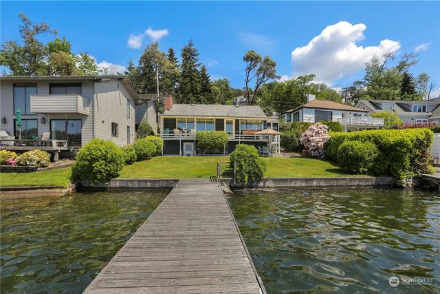 an aerial view of a house with a garden and trees