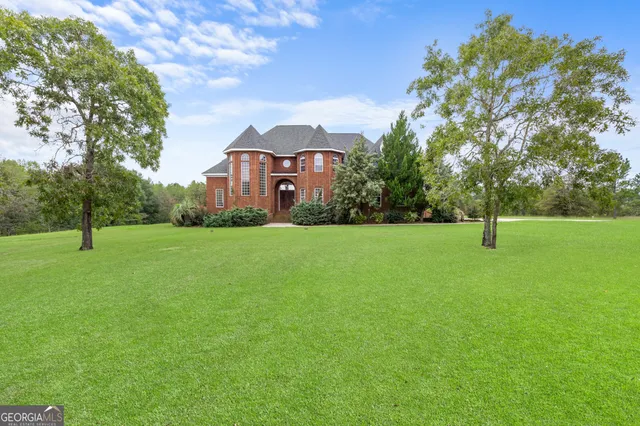 a front view of a house with a yard