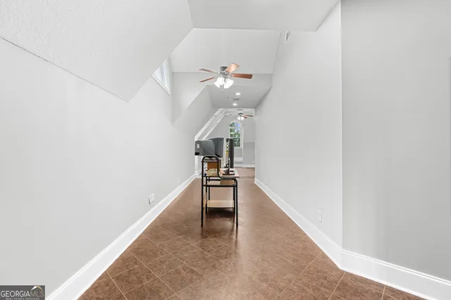 a view of a hallway with staircase