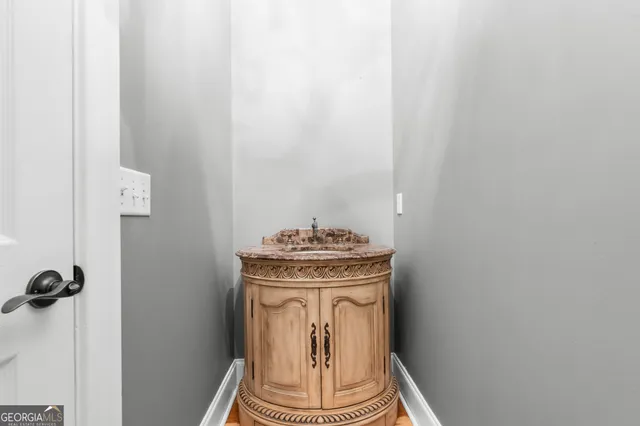 a view of a storage and utility room with washer dryer