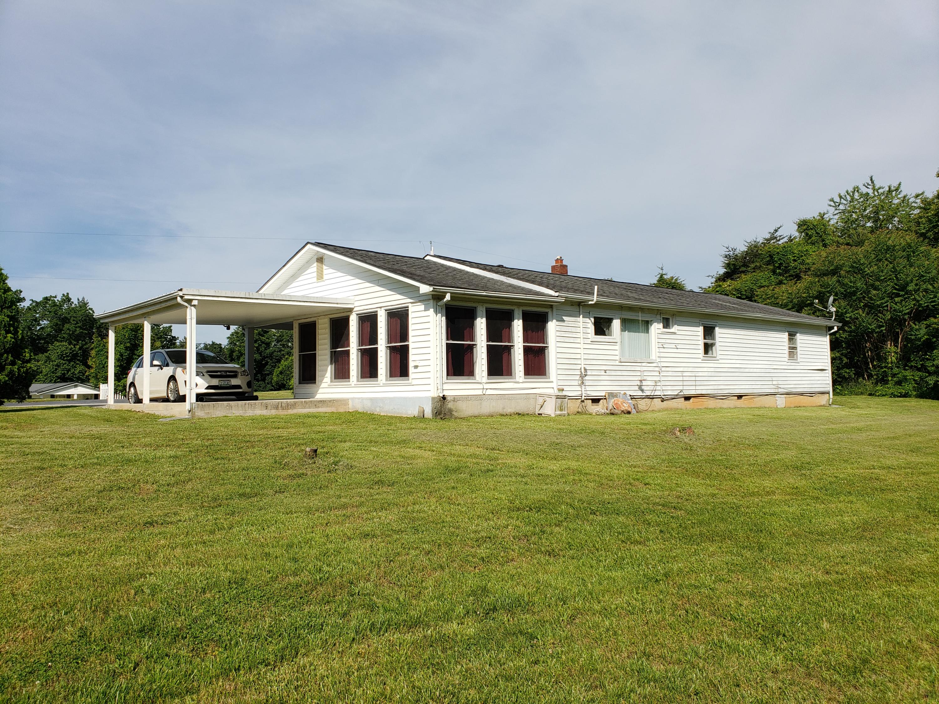 3529 Old Forge Road Rocky Mount, VA 24151 - Photo 2 of 14 a front view of a house with a garden