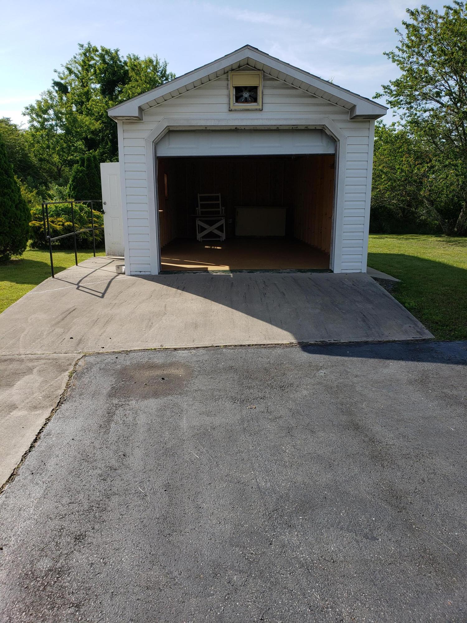 3529 Old Forge Road Rocky Mount, VA 24151 - Photo 11 of 14 a front view of a house with a yard and garage