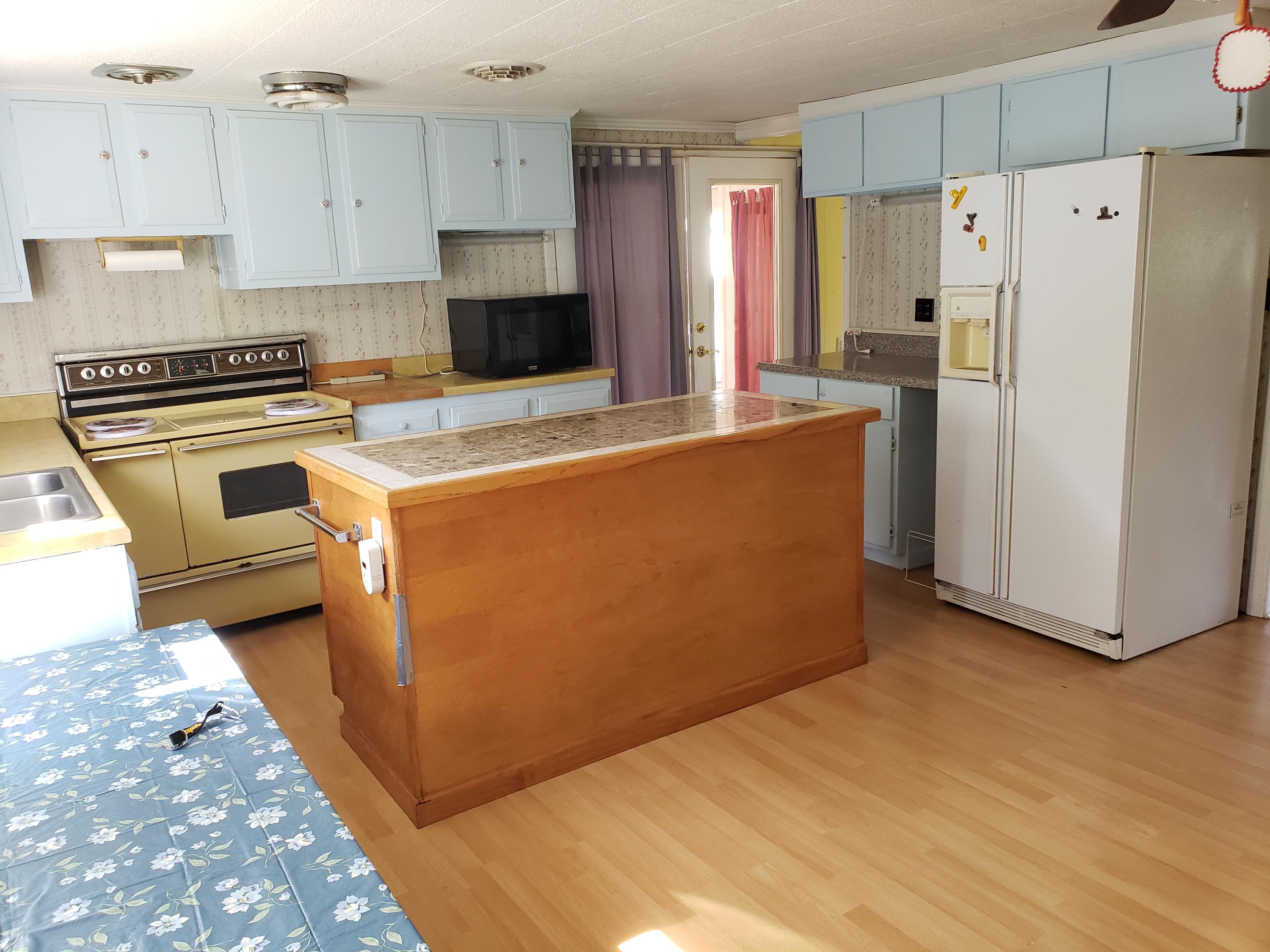 3529 Old Forge Road Rocky Mount, VA 24151 - Photo 4 of 14 a kitchen with stainless steel appliances a refrigerator and a stove