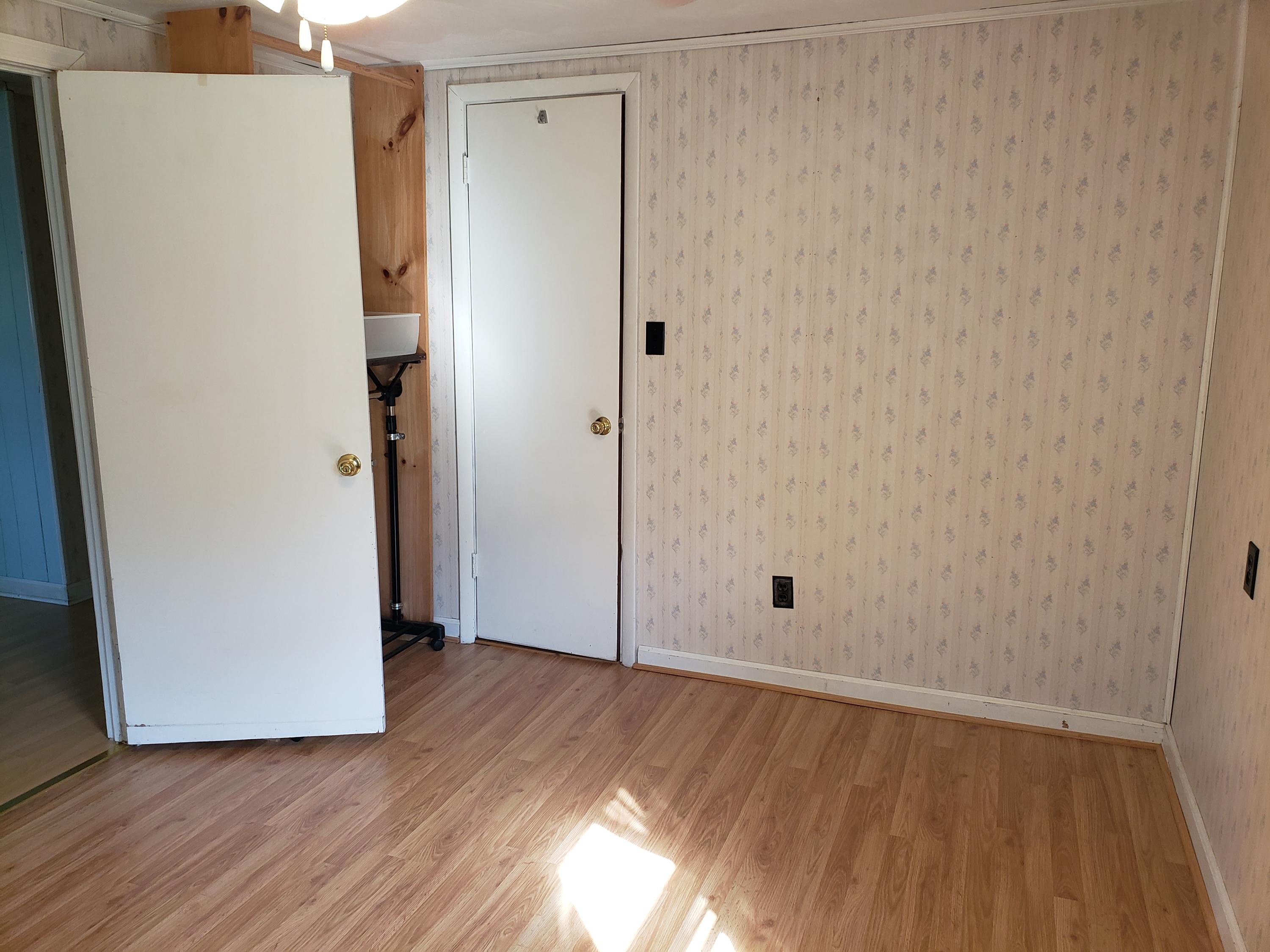 3529 Old Forge Road Rocky Mount, VA 24151 - Photo 7 of 14 a view of an empty room with wooden floor and a window