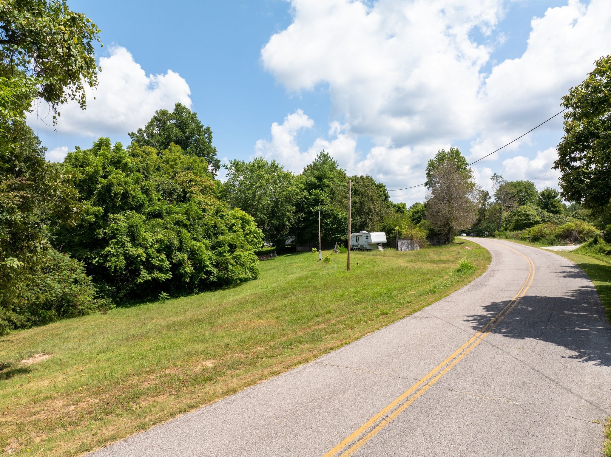 1374 Deal Road Burns, TN 37029 - Photo 7 of 24 a view of a playground with basketball court