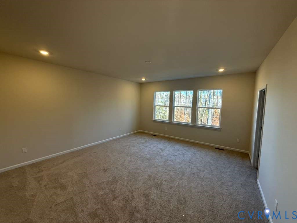 6473 Fennec Run Moseley, VA 23120 - Photo 13 of 16 Spare room with recessed lighting and light colore