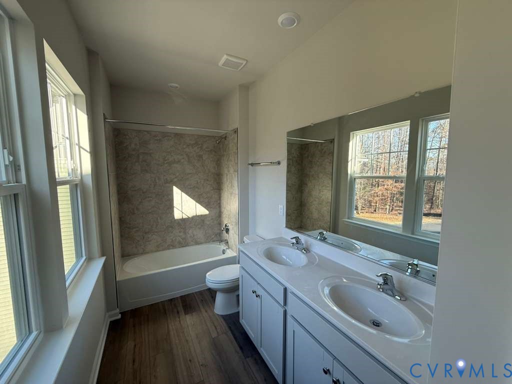 6473 Fennec Run Moseley, VA 23120 - Photo 16 of 16 Full bathroom featuring double vanity, bathing tub