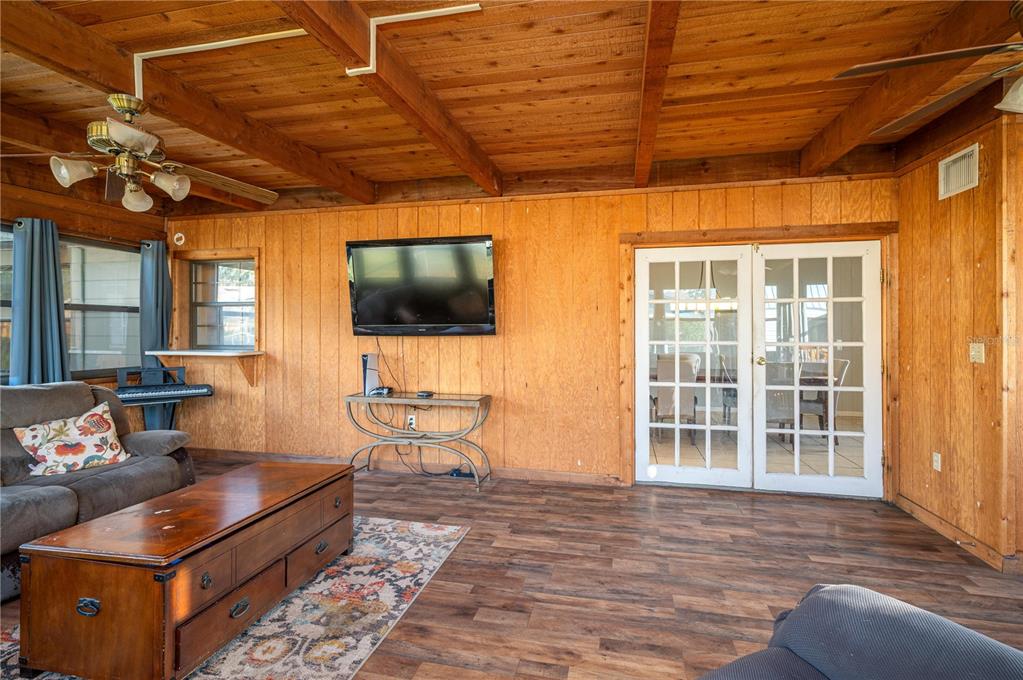 1330 Spring Court Bartow, FL 33830 - Photo 13 of 40 a living room with furniture a flat screen tv and kitchen view
