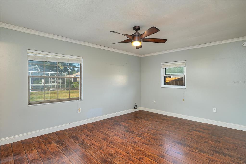 1330 Spring Court Bartow, FL 33830 - Photo 15 of 40 a view of empty room with wooden floor and fan