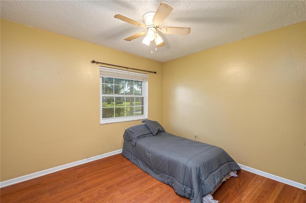 1330 Spring Court Bartow, FL 33830 - Photo 22 of 40 a bedroom with a bed and a window