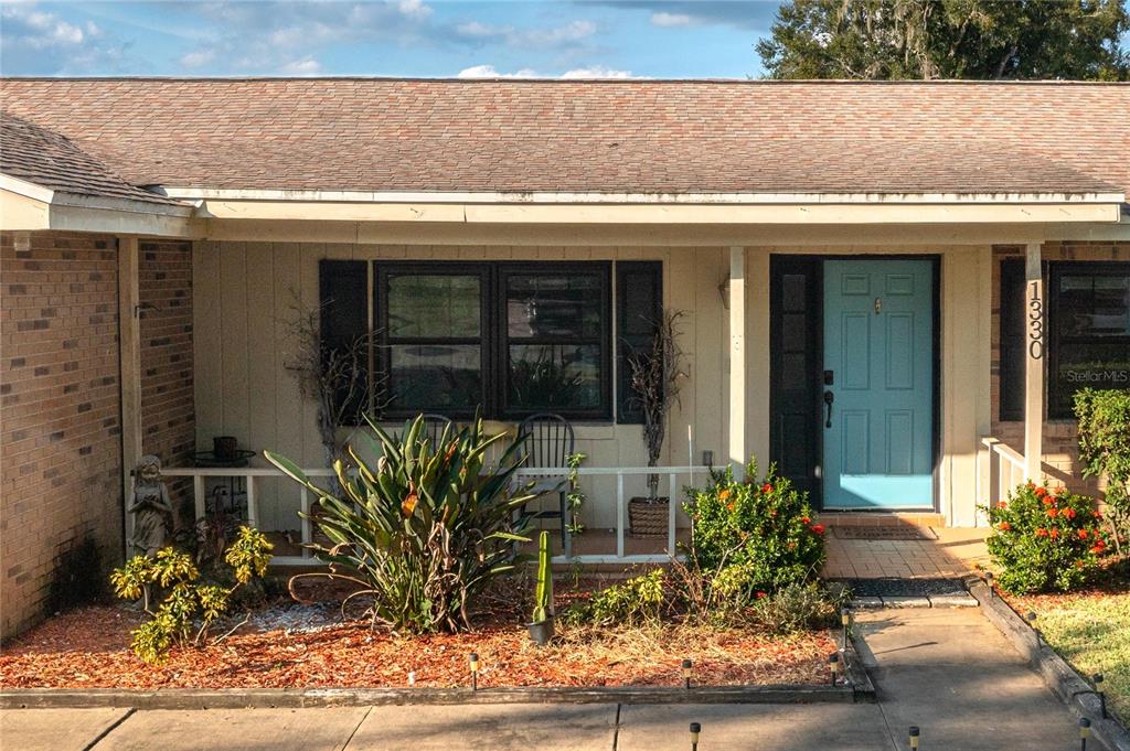 1330 Spring Court Bartow, FL 33830 - Photo 4 of 40 a potted plant sitting in front of a building