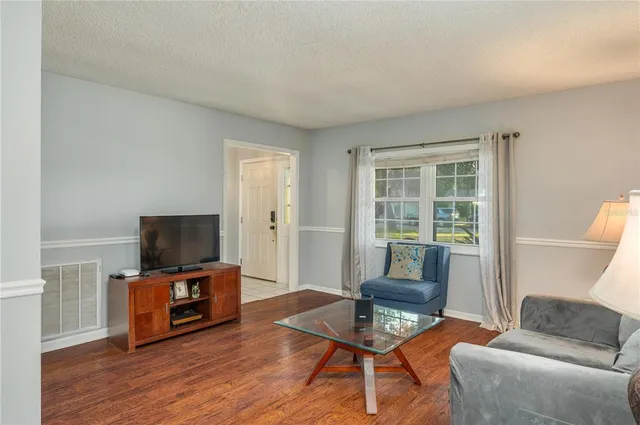 a kitchen with granite countertop cabinets stainless steel appliances a sink and a window